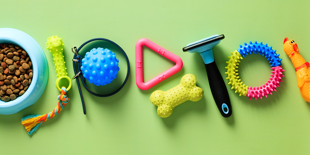 Pet toys spread out across the monochrome light green background.