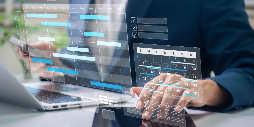 A businessman using a laptop. Virtual calendar is displayed across the image. 